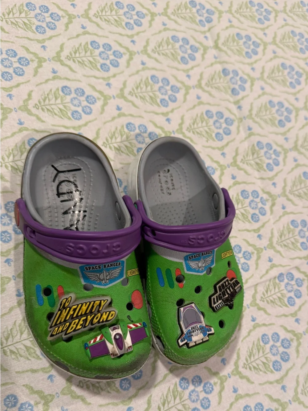 CROCS Kids Green Buzz Lightyear Clogs with Purple Heel Straps